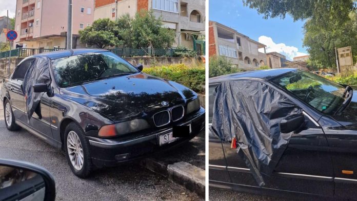 Nepoznati čovjek plastičnom folijom zaštitio prozor od kiše